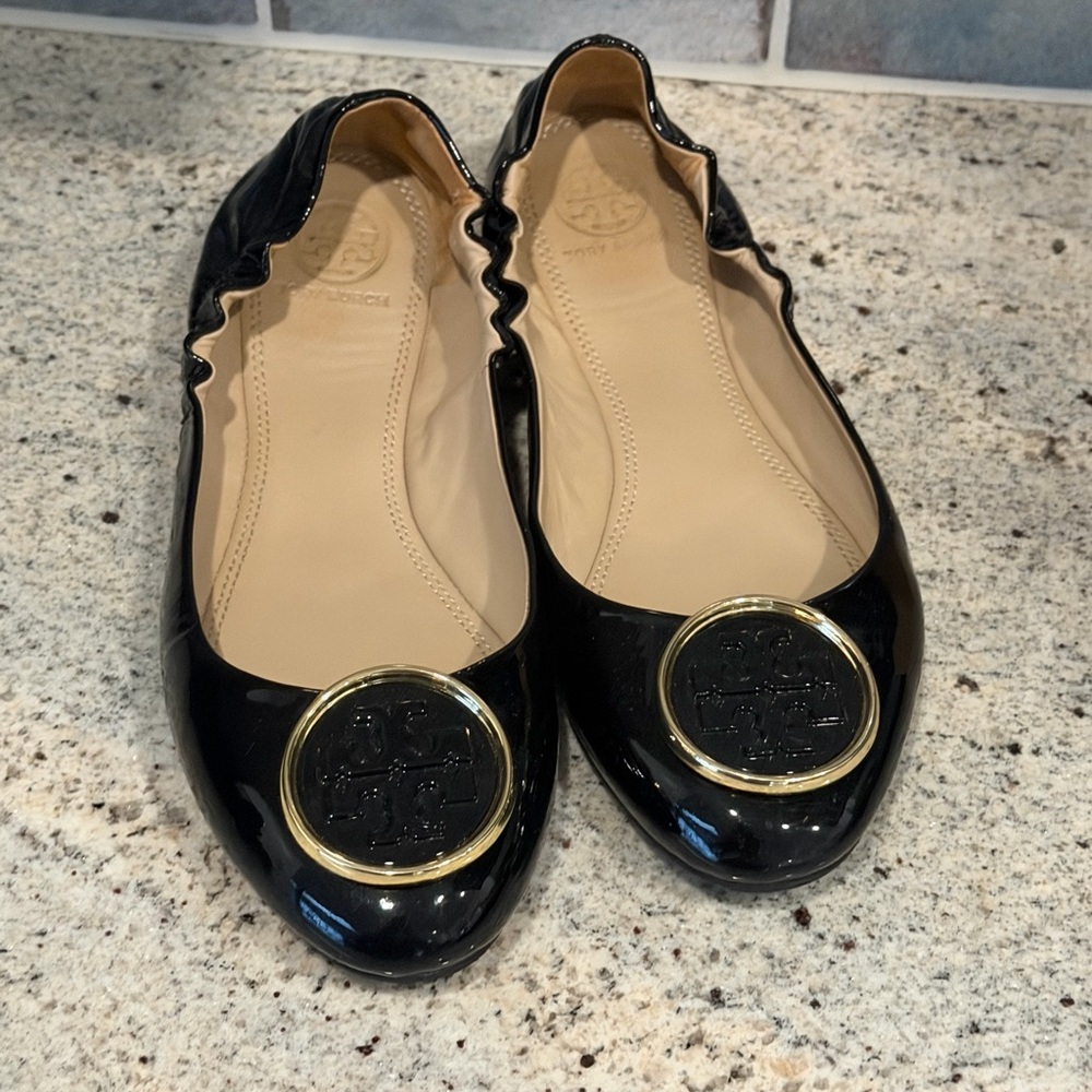 Tory Burch Glossy Black Flats with Gold Emblem